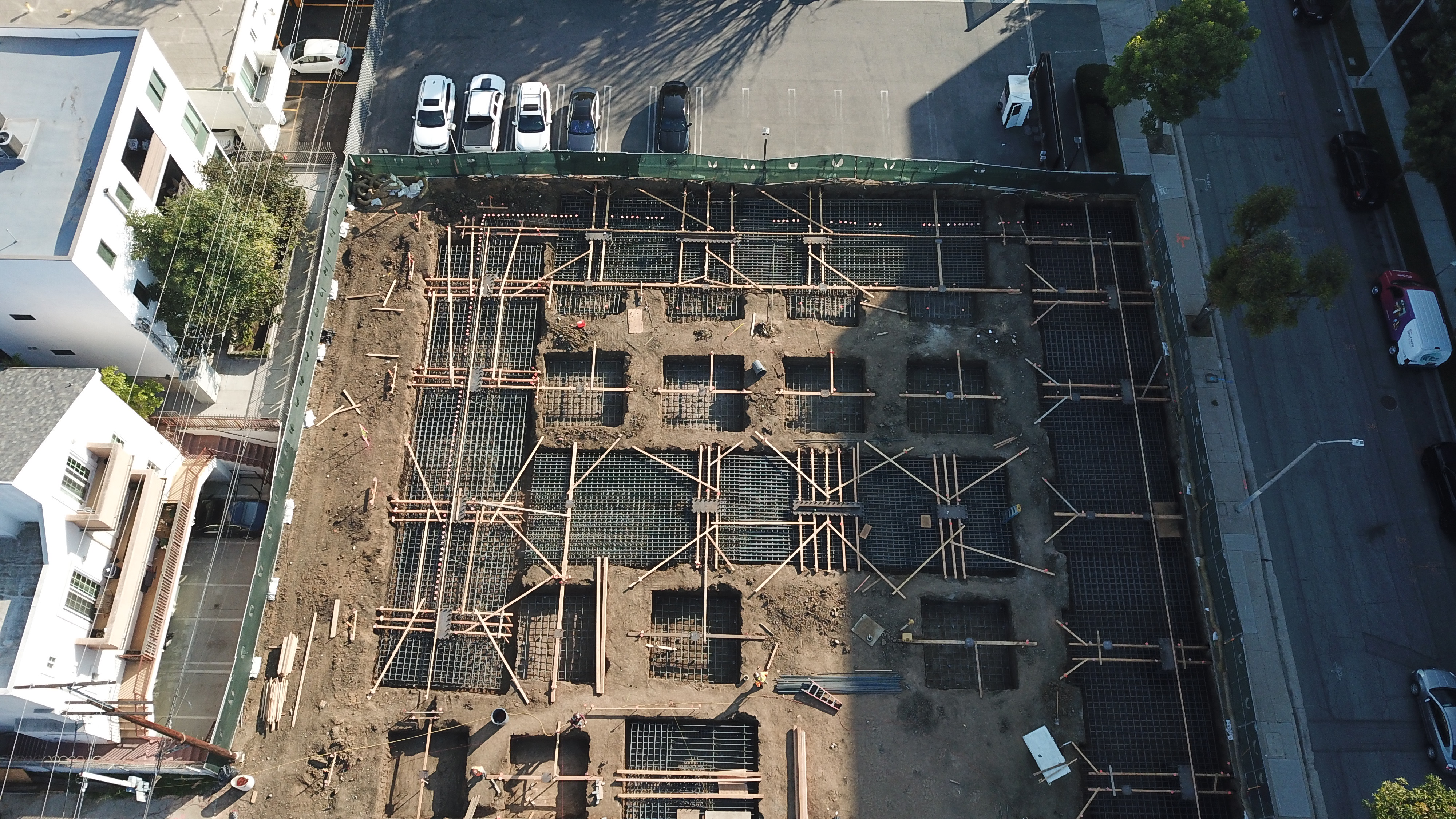 Concrete crew placing foundations and slab forms