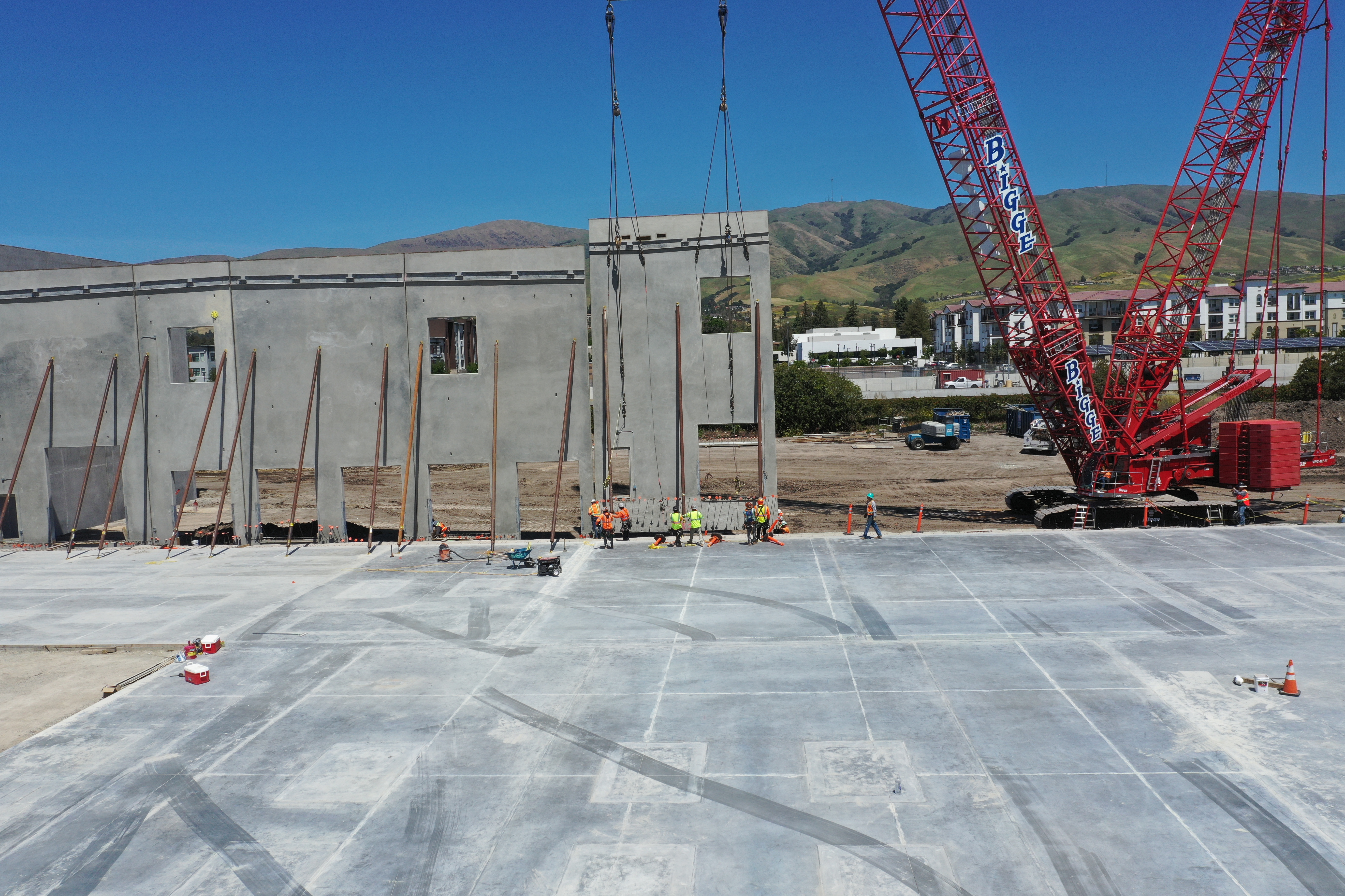 Tilt-up wall panels staged for installation